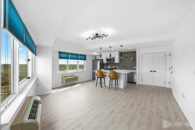 a view of a kitchen with furniture and a window