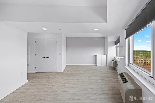 a view of a living room with a large window