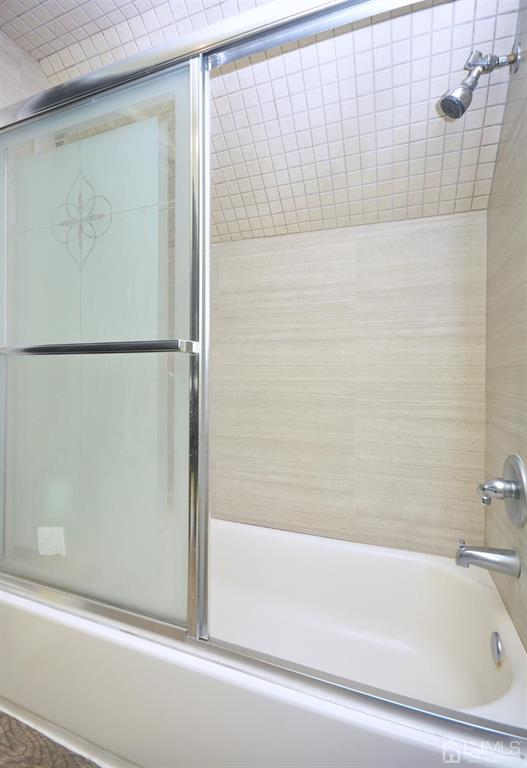 355 Metlars Lane Piscataway, NJ 08854 - Photo 11 of 29 a bathroom with a bathtub and a shower