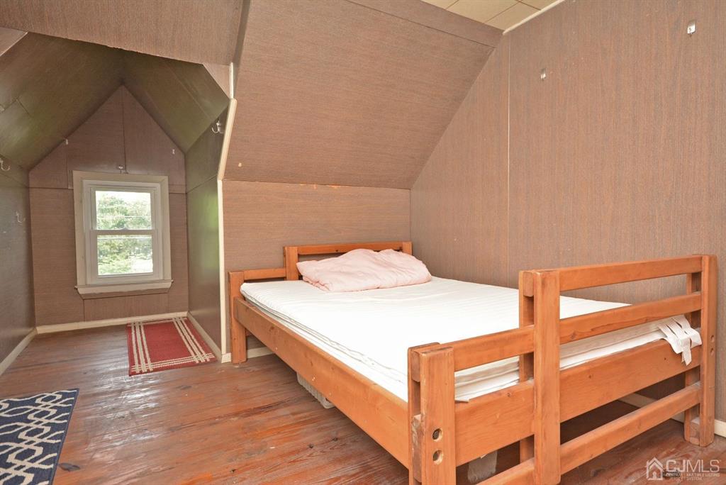 355 Metlars Lane Piscataway, NJ 08854 - Photo 12 of 29 a bed room with a bed and a window