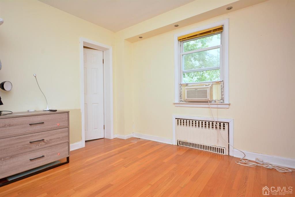 355 Metlars Lane Piscataway, NJ 08854 - Photo 20 of 29 a view of room with cabinet and wooden floor