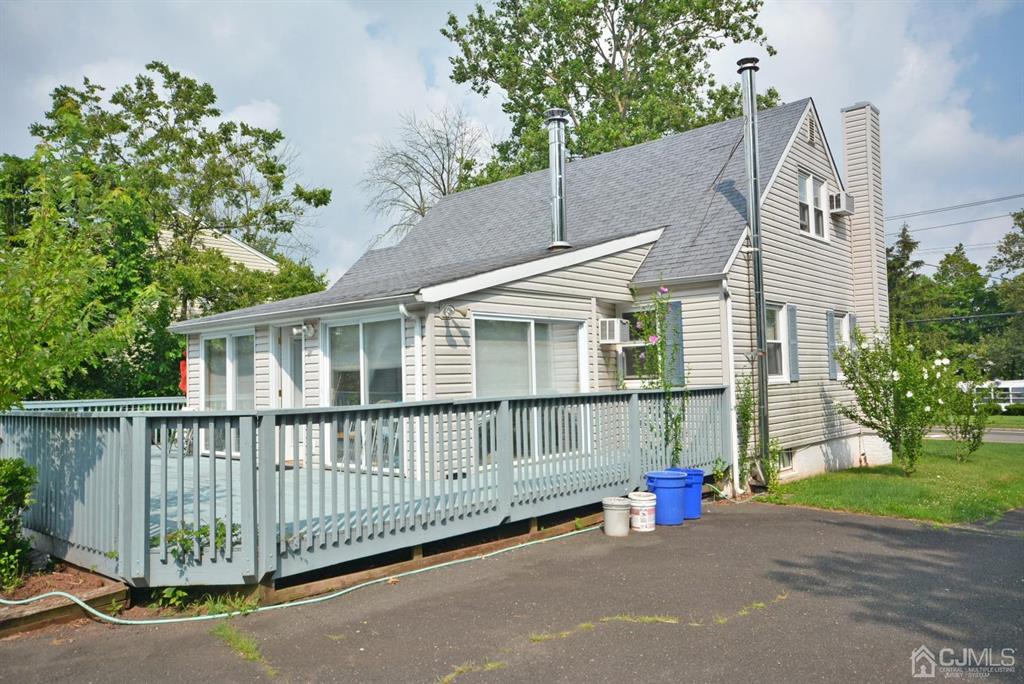 355 Metlars Lane Piscataway, NJ 08854 - Photo 2 of 29 a view of a house with a small yard and a large tree