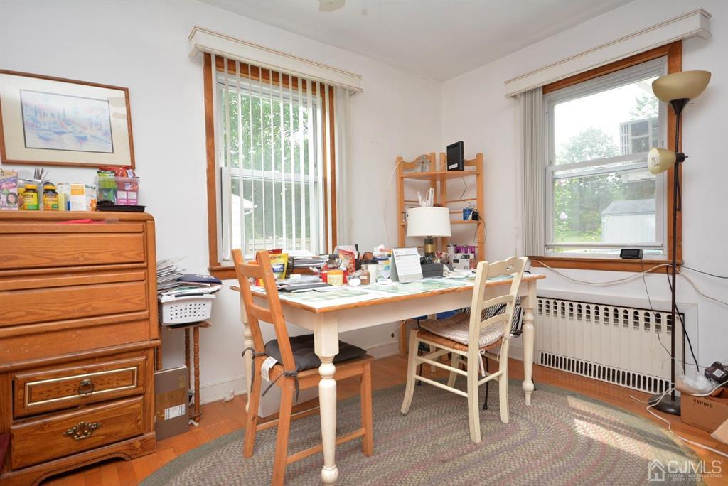 355 Metlars Lane Piscataway, NJ 08854 - Photo 26 of 29 a view of a dining room with furniture window and wooden floor