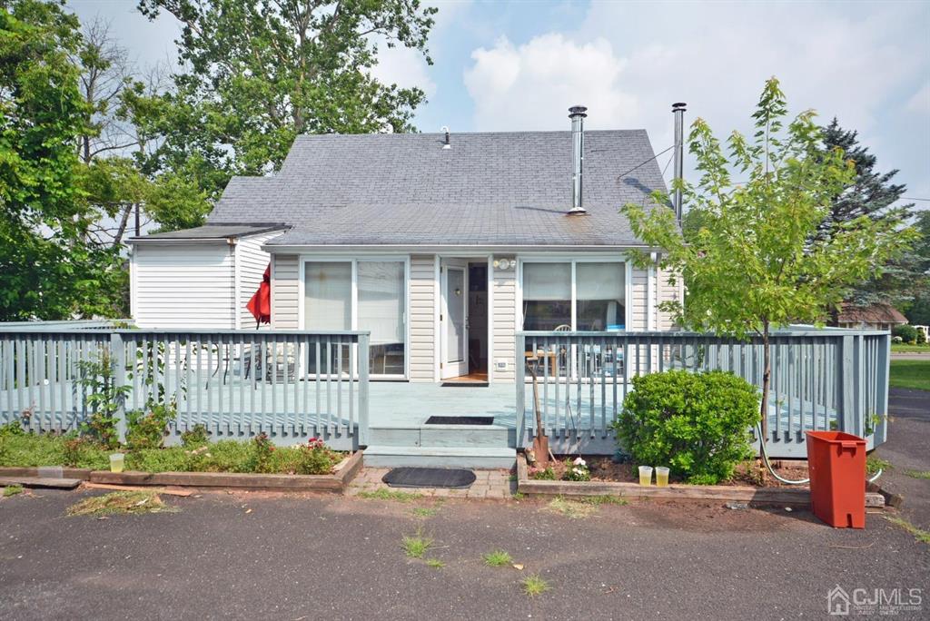 355 Metlars Lane Piscataway, NJ 08854 - Photo 5 of 29 a view of a house with a garden and pathway