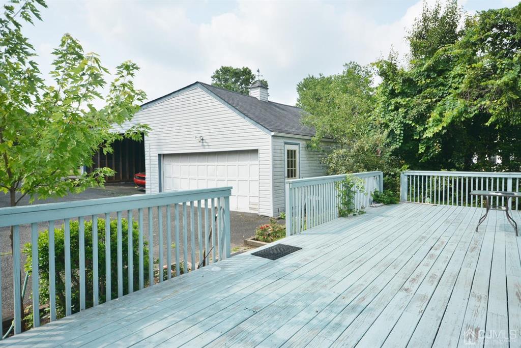 355 Metlars Lane Piscataway, NJ 08854 - Photo 7 of 29 a view of a wooden deck and a yard