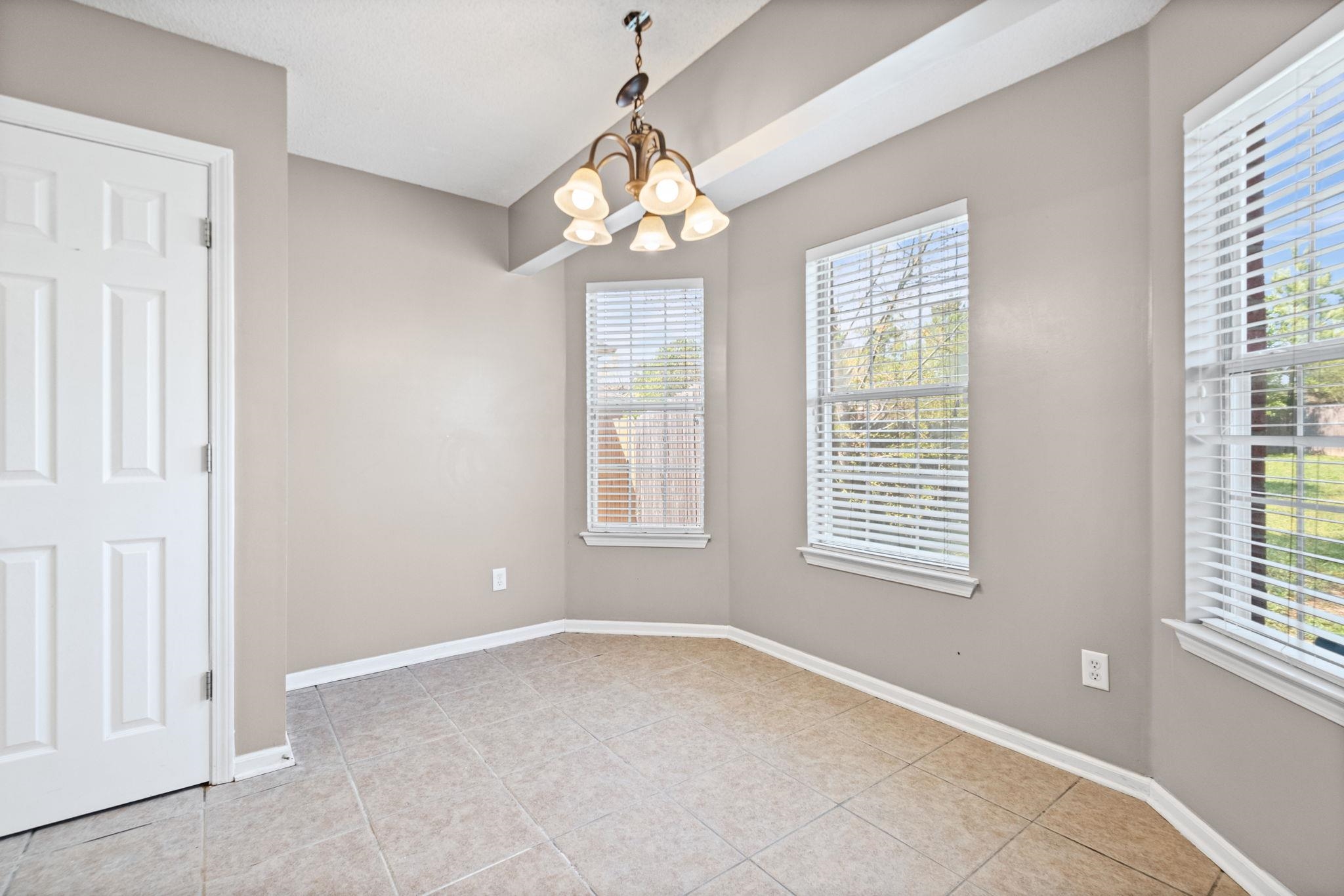 10018 Cameron Ridge Trail Memphis, TN 38016 - Photo 12 of 29 a view of an empty room with a window