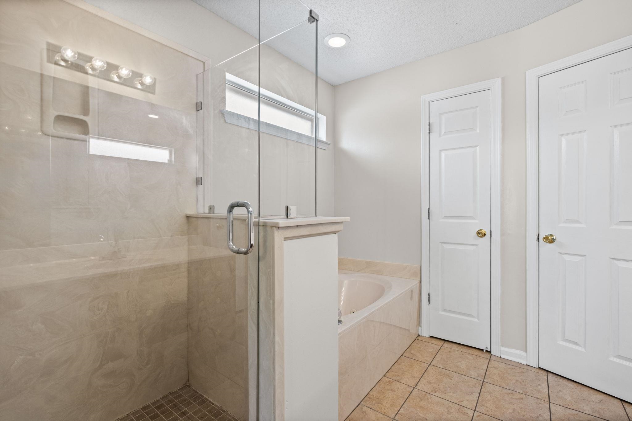 10018 Cameron Ridge Trail Memphis, TN 38016 - Photo 18 of 29 a bathroom with a shower