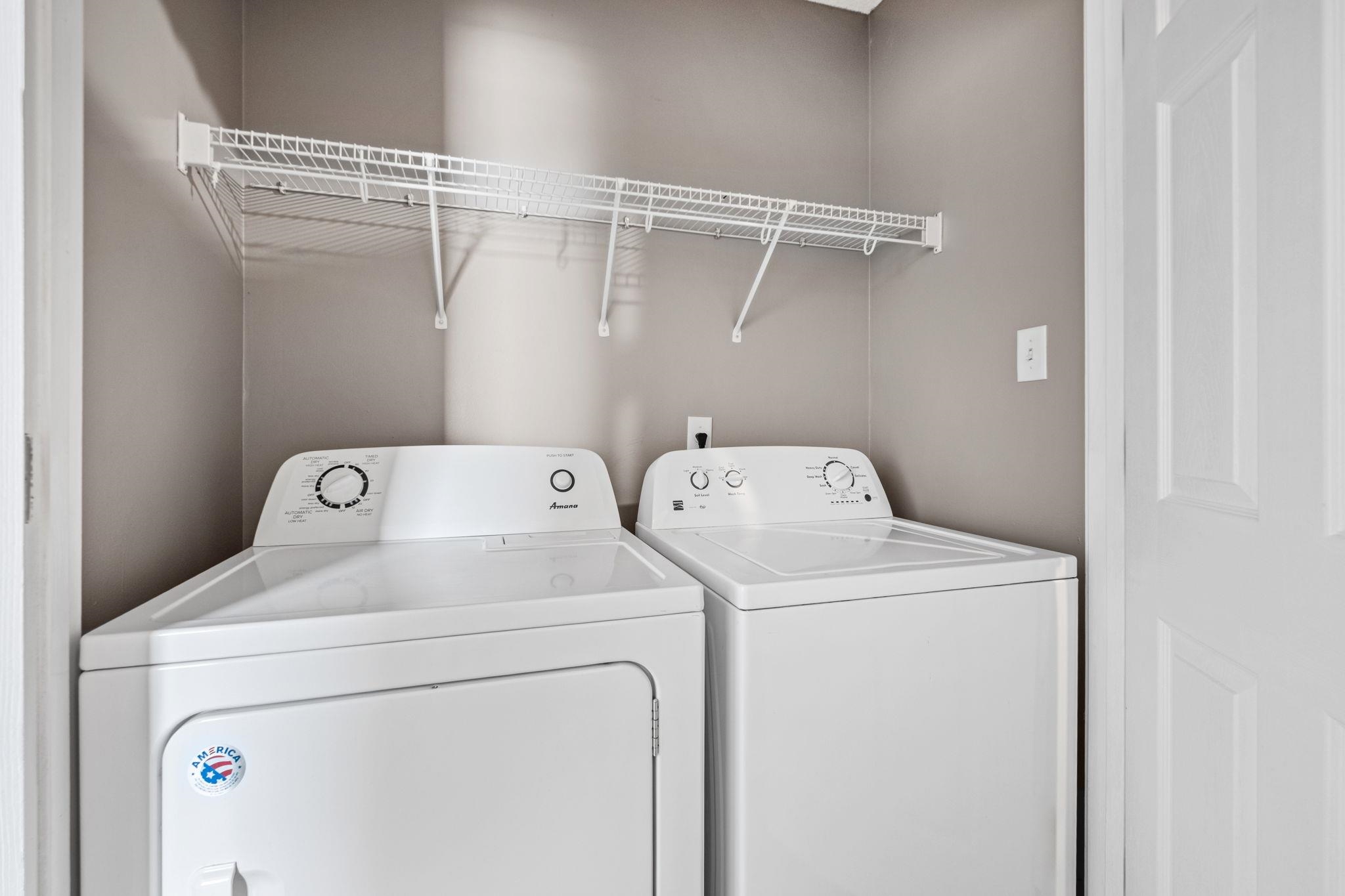 10018 Cameron Ridge Trail Memphis, TN 38016 - Photo 25 of 29 a utility room with dryer and washer