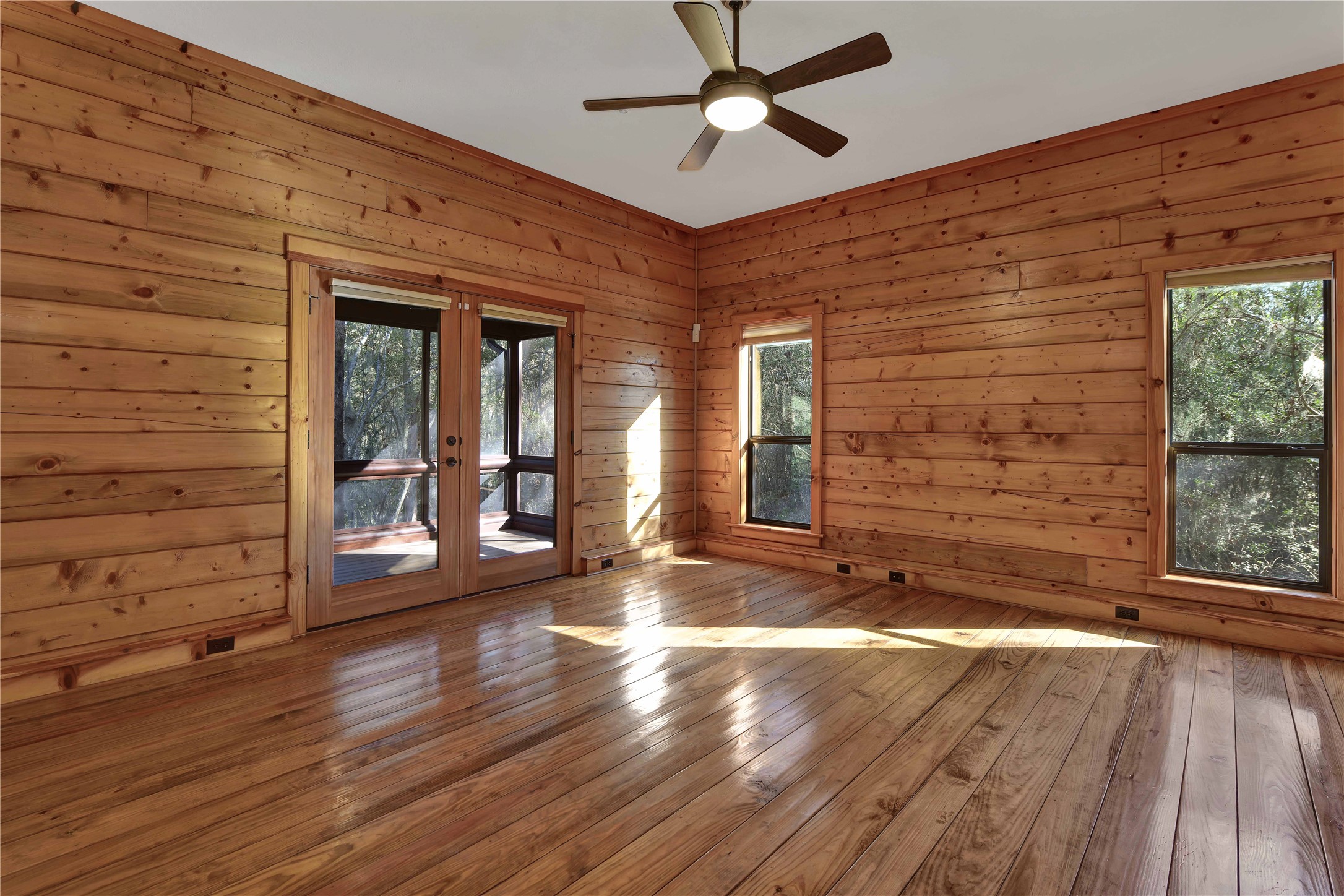 69 Artesian Avenue Cleveland, TX 77327 - Photo 16 of 43 a view of a livingroom with wooden floor and a ceiling fan
