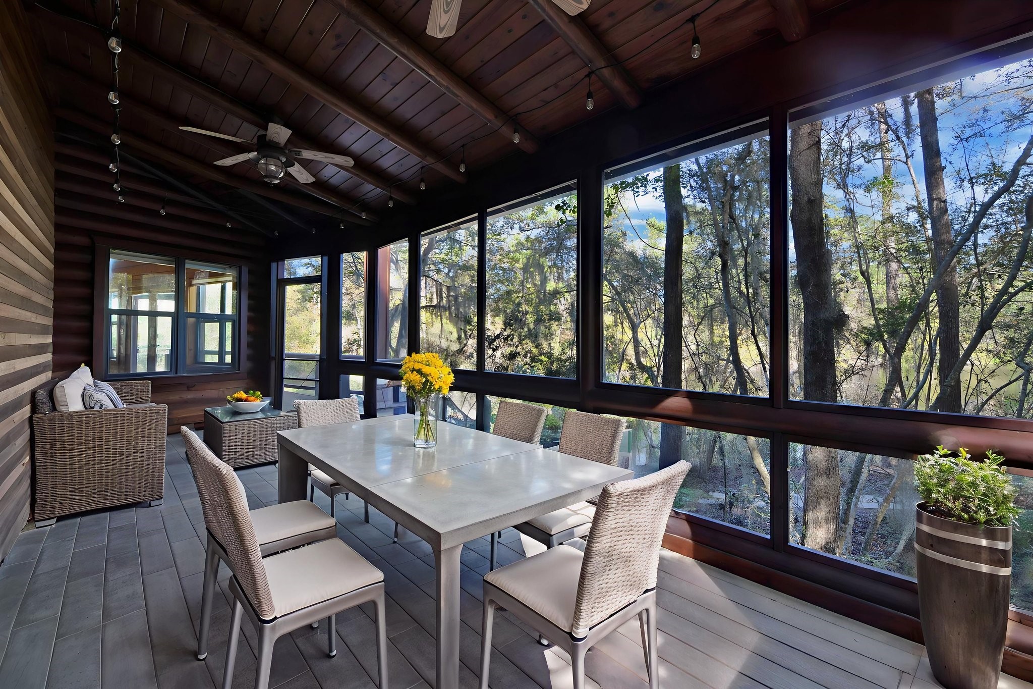 69 Artesian Avenue Cleveland, TX 77327 - Photo 27 of 43 a view of a dining room with furniture large windows and wooden floor