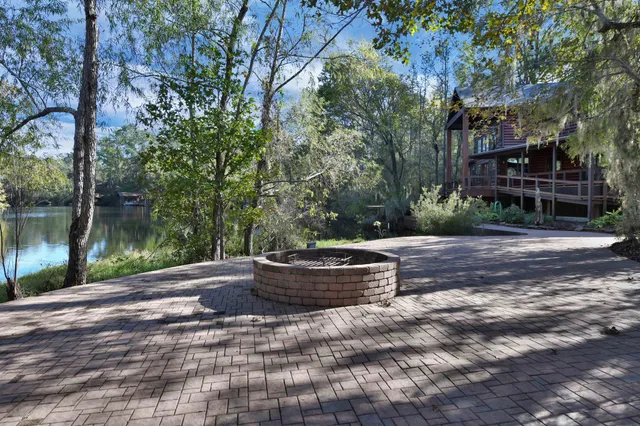 a view of a backyard with sitting area and furniture