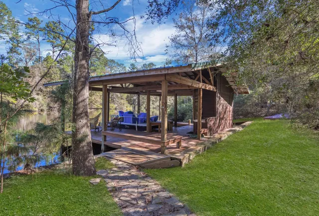 a view of a roof deck with wooden fence