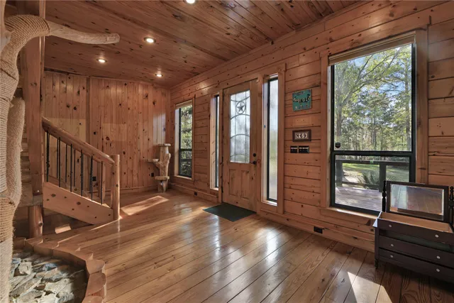 a view of an entryway with wooden floor