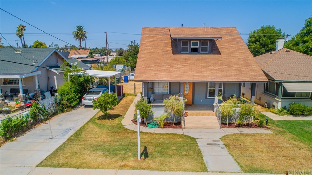 2525 Orange Street Riverside, CA 92501 - Photo 1 of 1 a front view of house and yard with green space