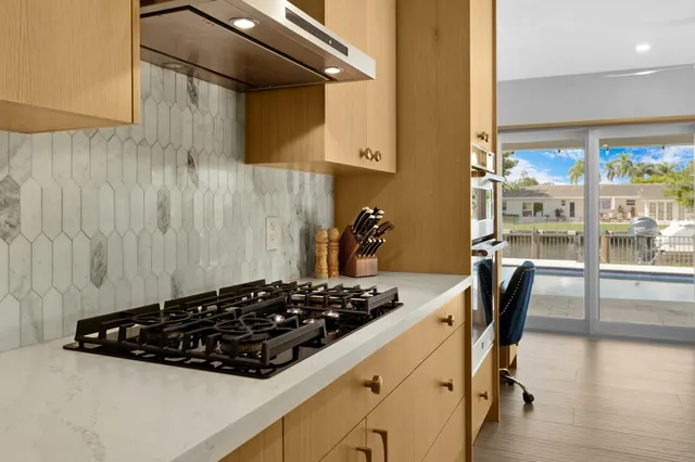 a kitchen with a table and chairs