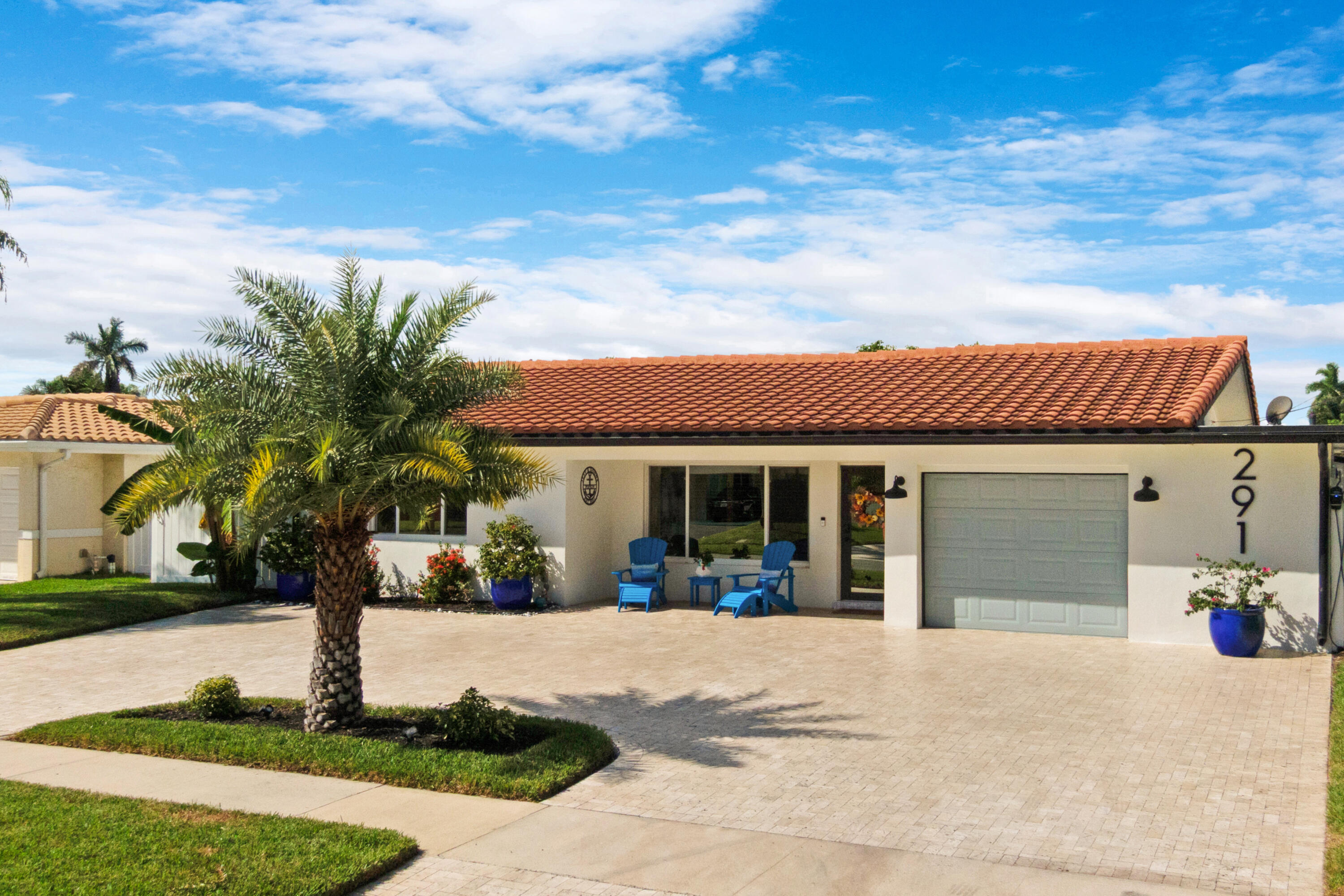 291 Southeast 5th Avenue Pompano Beach, FL 33060 - Photo 2 of 62 a view of a white house with a yard