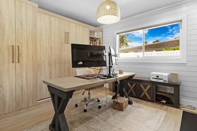 a view of a swimming pool in a backyard