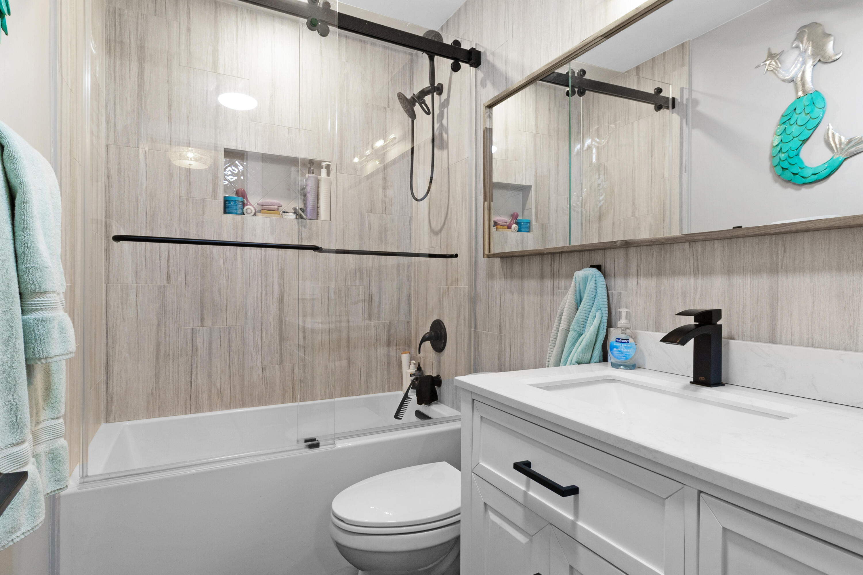 291 Southeast 5th Avenue Pompano Beach, FL 33060 - Photo 29 of 62 a bathroom with a sink a toilet and shower