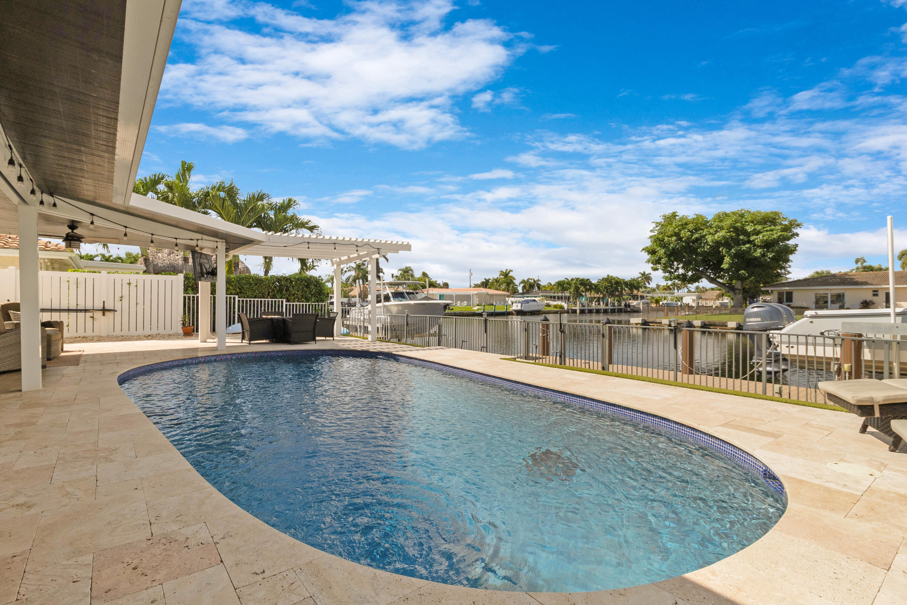 291 Southeast 5th Avenue Pompano Beach, FL 33060 - Photo 30 of 62 a view of a swimming pool with an outdoor seating
