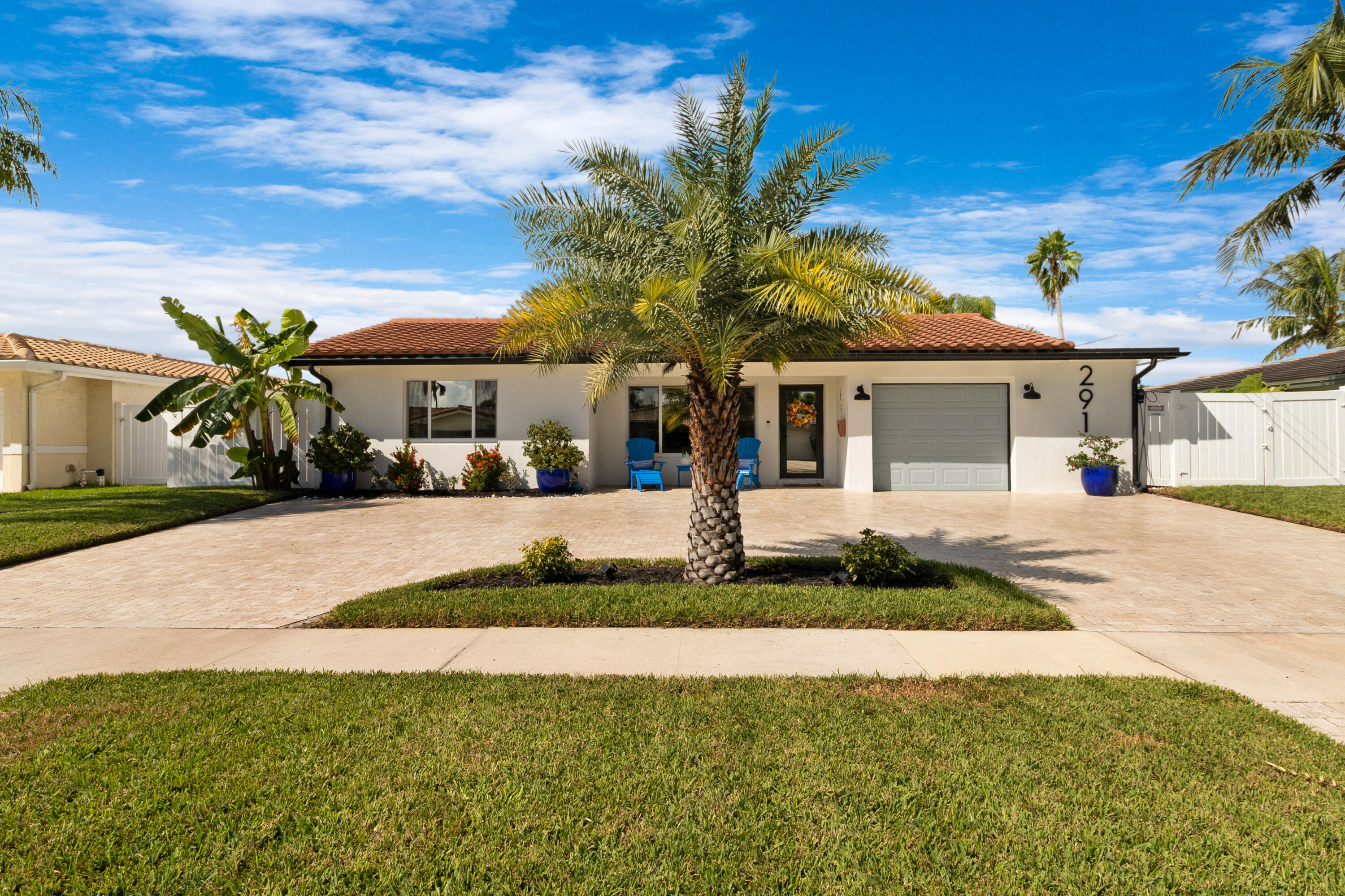 291 Southeast 5th Avenue Pompano Beach, FL 33060 - Photo 3 of 62 a front view of house with yard and green space
