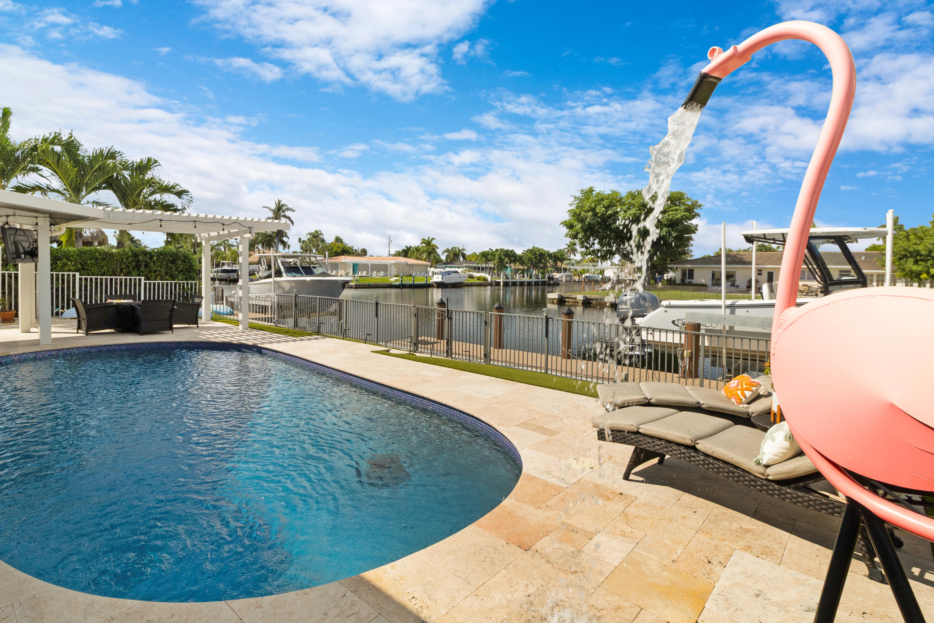 291 Southeast 5th Avenue Pompano Beach, FL 33060 - Photo 31 of 62 a view of a swimming pool in a backyard