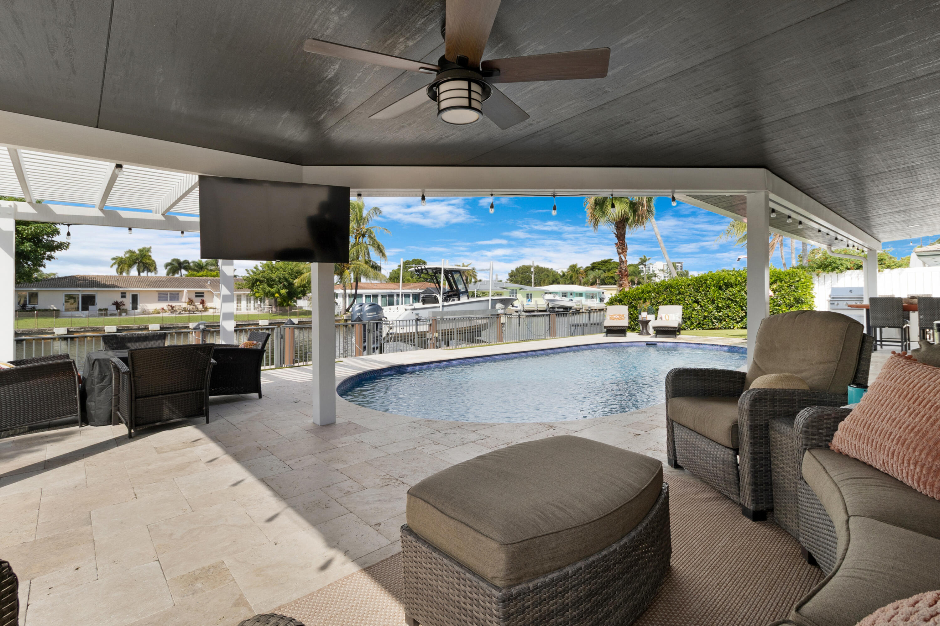 291 Southeast 5th Avenue Pompano Beach, FL 33060 - Photo 33 of 62 a living room with stainless steel appliances kitchen island granite countertop furniture and a large window