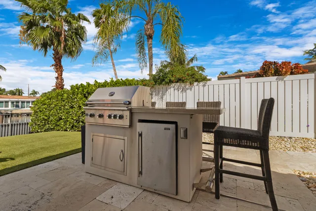 a view of swimming pool with outdoor seating and seating area