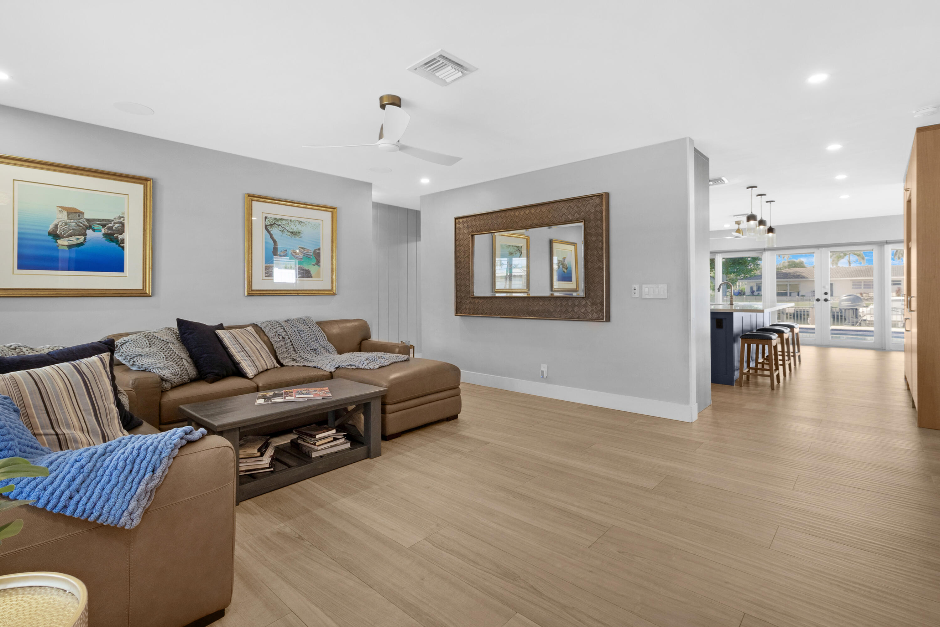 291 Southeast 5th Avenue Pompano Beach, FL 33060 - Photo 5 of 62 a living room with furniture and painting on the wall