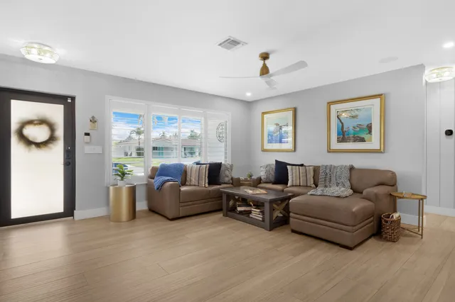 a living room with furniture and a window
