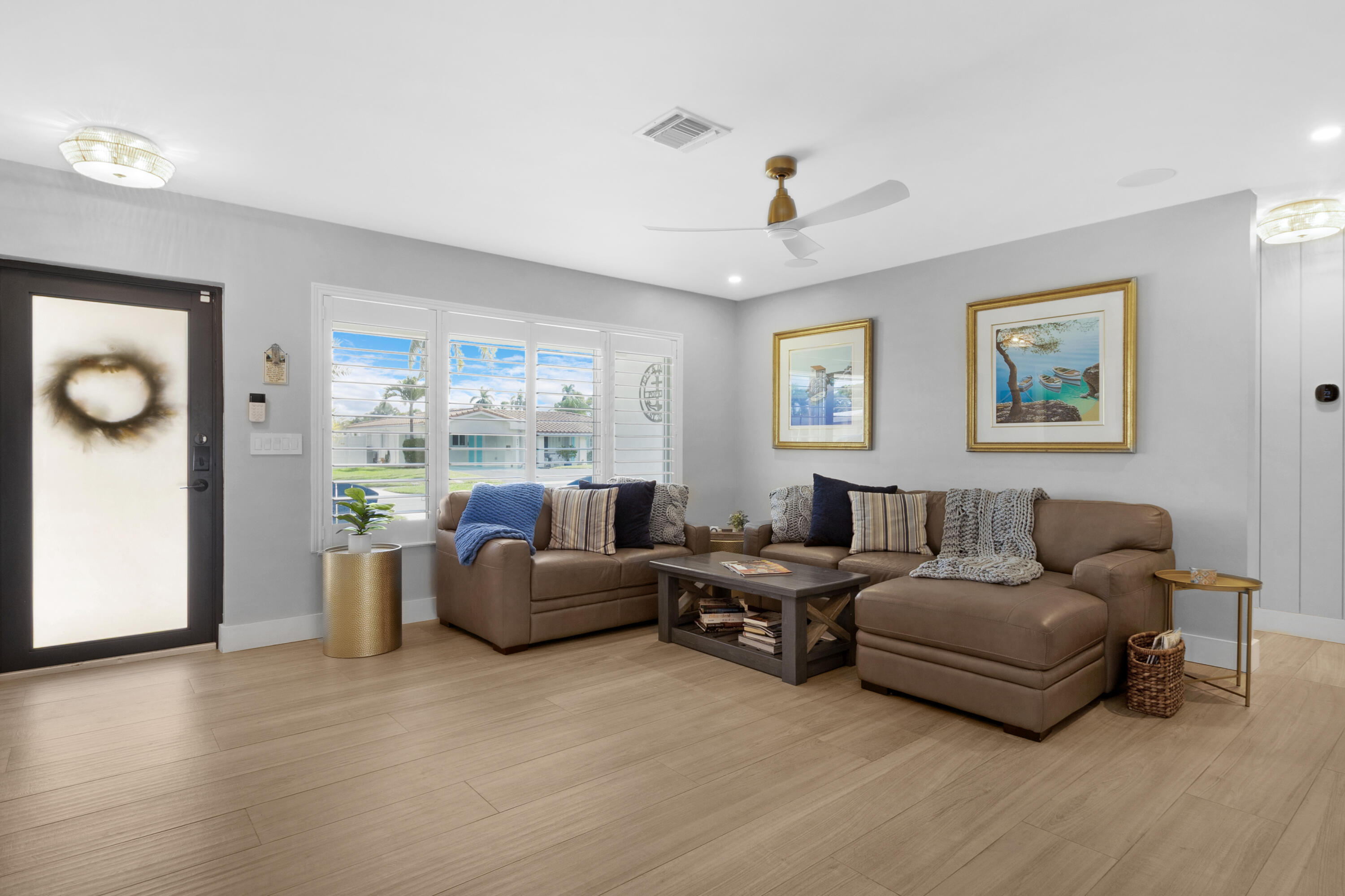 291 Southeast 5th Avenue Pompano Beach, FL 33060 - Photo 7 of 62 a living room with furniture and a window