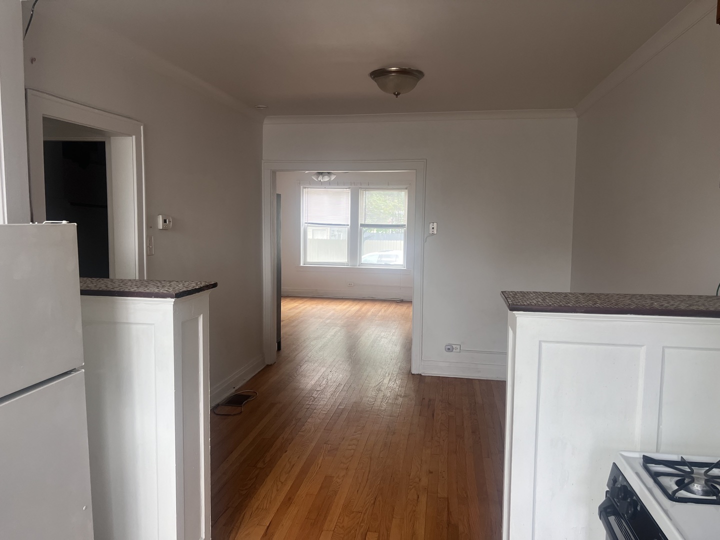 5907 West Arthington Street, Unit 1 Chicago, IL 60644 - Photo 9 of 16 a view of hallway with wooden floor