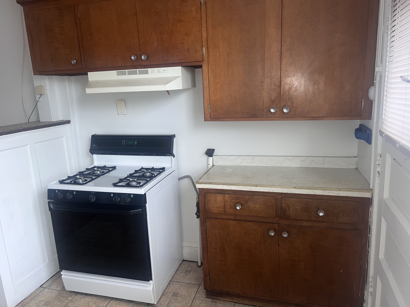 5907 West Arthington Street, Unit 1 Chicago, IL 60644 - Photo 14 of 16 a stove top oven sitting inside of a kitchen