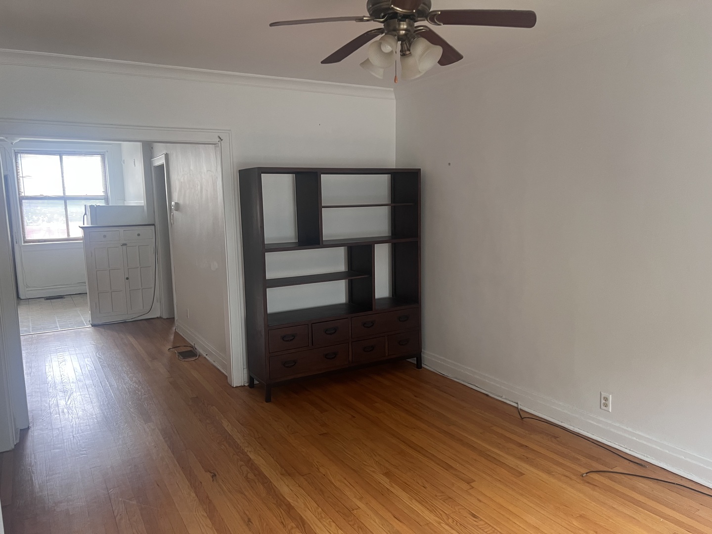 5907 West Arthington Street, Unit 1 Chicago, IL 60644 - Photo 6 of 16 wooden floor in an empty room with a window