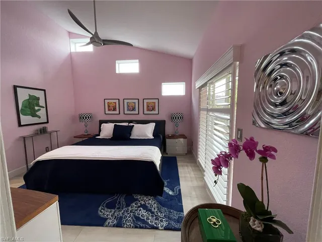 a bedroom with a bed dresser and a window