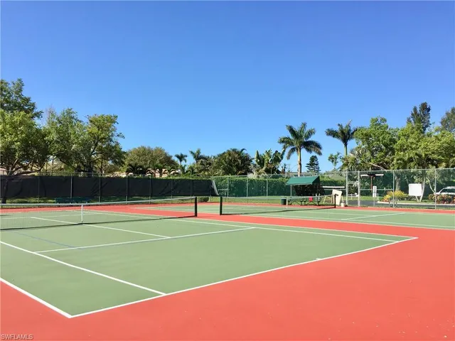 a view of an outdoor space and tennis court