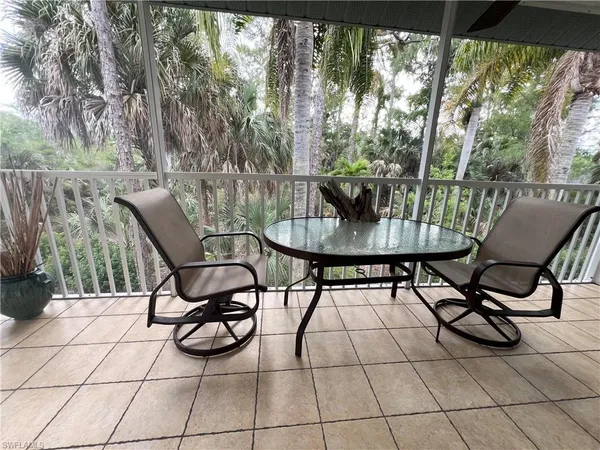 a view of a chairs and tables in the patio
