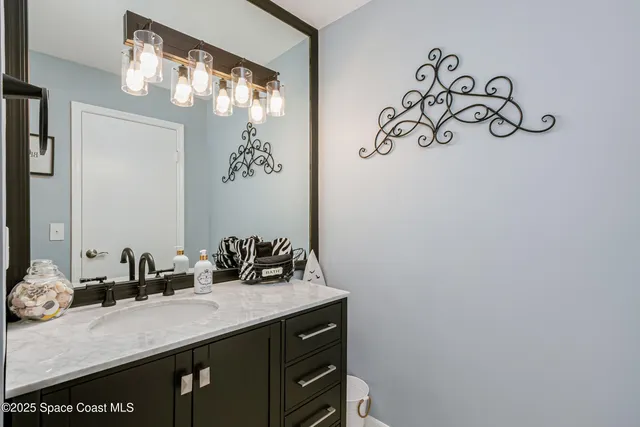 a bedroom with a bed and a night stand