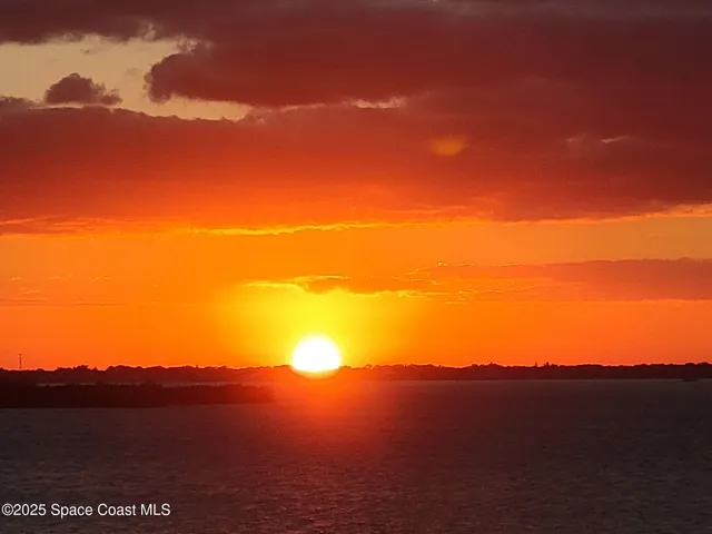 a view of balcony with wooden floor