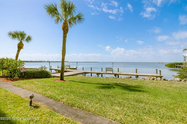 an aerial view of a city with ocean view