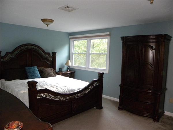 19 Highfield Road, Unit D Charlton, MA 01507 - Photo 12 of 19 a living room with a bed furniture and a window
