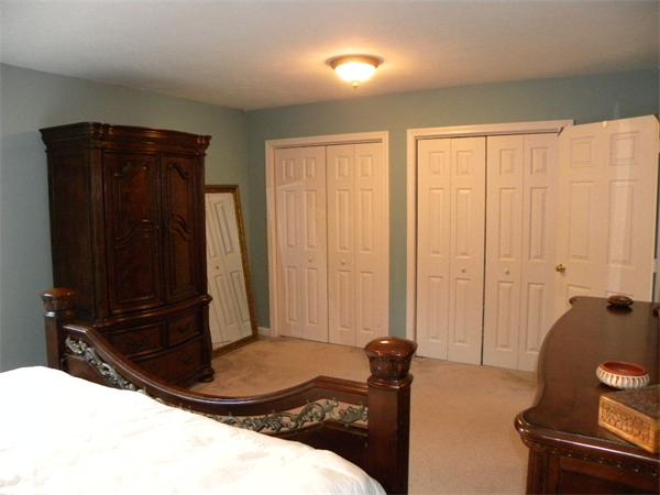 19 Highfield Road, Unit D Charlton, MA 01507 - Photo 13 of 19 a bedroom with a bed and a dresser