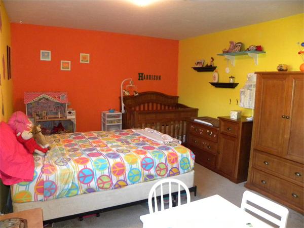 19 Highfield Road, Unit D Charlton, MA 01507 - Photo 14 of 19 a bedroom with a bed and wooden floor