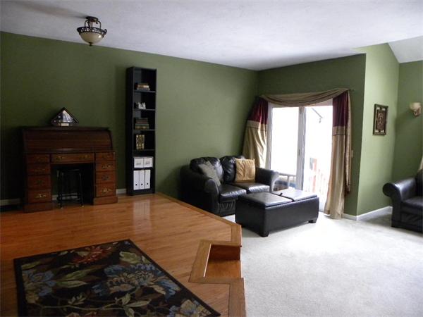 19 Highfield Road, Unit D Charlton, MA 01507 - Photo 19 of 19 a living room with furniture and a fireplace