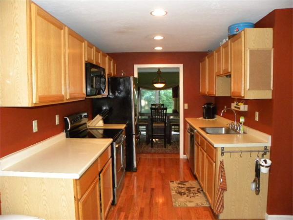19 Highfield Road, Unit D Charlton, MA 01507 - Photo 3 of 19 a kitchen with a sink a stove and cabinets