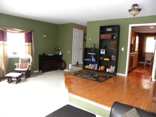 19 Highfield Road, Unit D Charlton, MA 01507 - Photo 4 of 19 a room with furniture and a flat screen tv