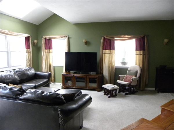 19 Highfield Road, Unit D Charlton, MA 01507 - Photo 6 of 19 a living room with furniture and a flat screen tv