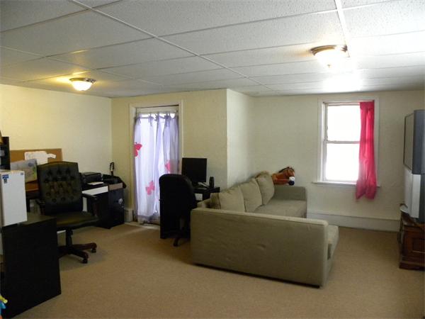 19 Highfield Road, Unit D Charlton, MA 01507 - Photo 8 of 19 a living room with furniture and a flat screen tv
