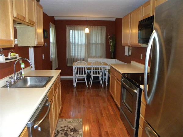 19 Highfield Road, Unit D Charlton, MA 01507 - Photo 9 of 19 a kitchen with stainless steel appliances granite countertop a sink a stove and a refrigerator