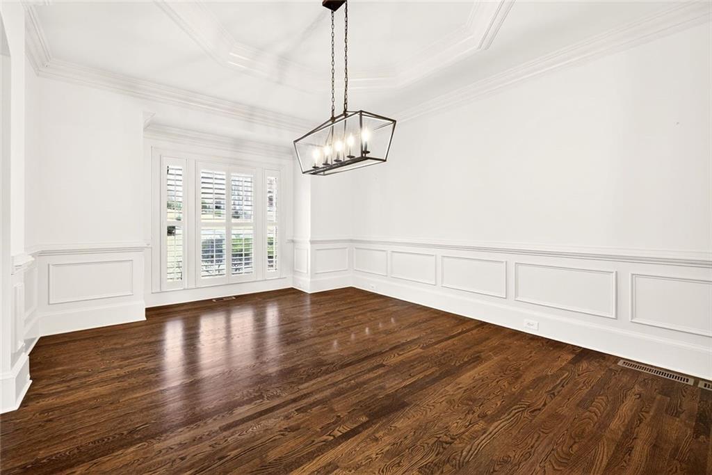 2910 Creek Tree Lane Cumming, GA 30041 - Photo 17 of 75 a view of empty room with wooden floor and windows