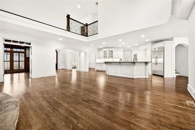 a view of a livingroom with wooden floor and fireplace